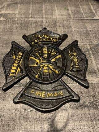 Vintage Iron Fireman Sign Black And Yellow