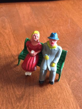 Vintage Miniature Painted Cast Iron Man & Woman Sitting On Park Bench