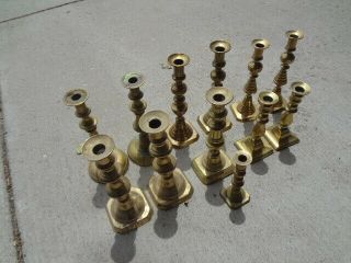 Several Pairs Of 19th Century Brass Push - Up Candlesticks.