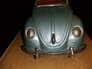 Vintage Worldwide Tin Volkswagen Convertible Batt operated,  lited,  piston action 6