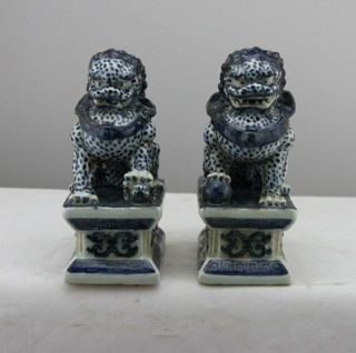 Chinese Old Pair Marked Blue And White Porcelain Foo Dogs Statues.