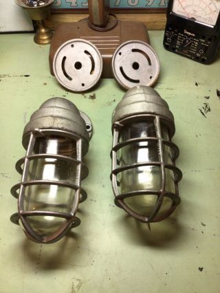 A Matching Vintage Crouse Hinds Explosion Proof Light Fixture Cages