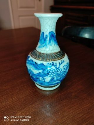 A Small Antique Chinese Porcelain Blue And White Crackle Vase
