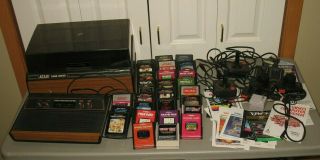 Vintage Atari Game System & Center,  27 Cartridges,  15 Instructions,  Joysticks More