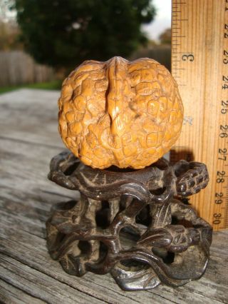 Old Chinese Hand Carved Walnut with Many Faces on Wood Lily Pad Stand 2