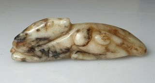 A Fine Qing Dynasty White & Russet Jade Carved As A Recumbent Hound Dog.