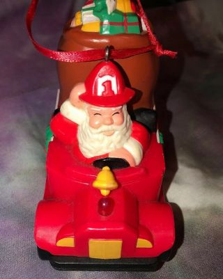 Vintage Avon Santa Claus Driving A Fire Truck Christmas Ornament Lights Up