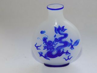 Chinese White Peking Glass Snuff Bottle With Blue Glass Dragon & Bird Overlay