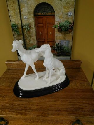 Classic Dog Figurine By A.  Wanting.  Porcelain On Black Base.