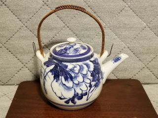 Vintage Japanese Blue And White Porcelain Teapot With Overhead Rattan Handle