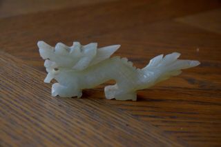 CHINESE CARVED PALE GREEN SOAPSTONE FIGURE OF A DRAGON 2