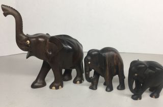 3 Vintage Wooden Elephant Figures Hand Carved Shell Eyes Dark Wood 6,  3,  2.  5”