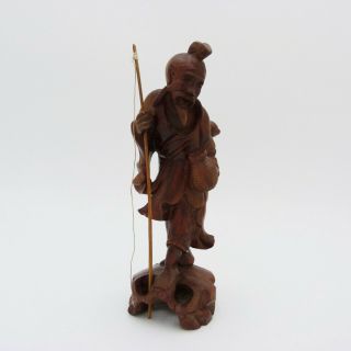 Chinese Carved Wooden Figure Of A Fisherman Holding A Fishing Rod