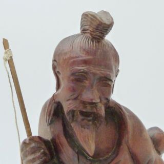 CHINESE CARVED WOODEN FIGURE OF A FISHERMAN HOLDING A FISHING ROD 2