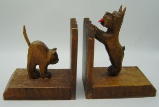 A Art Deco Carved Wooden Scotty Dog And Cat Bookends