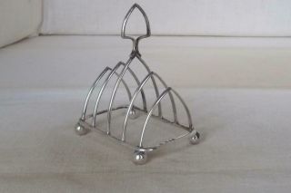 A Antique Solid Sterling Silver Four Slice Toast Rack London 1923.