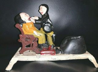 Vintage Dentist Pulling Tooth Mechanical Spring Loaded Cast Iron Coin Bank