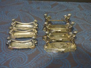 6 Meriden Victorian Silverplate Knife Rest With Pan.  2 Styles.  Both With Cherubs