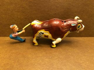 Vintage Mikuni (japan) Wind - Up Mooing Bull & Boy Pulling Tail