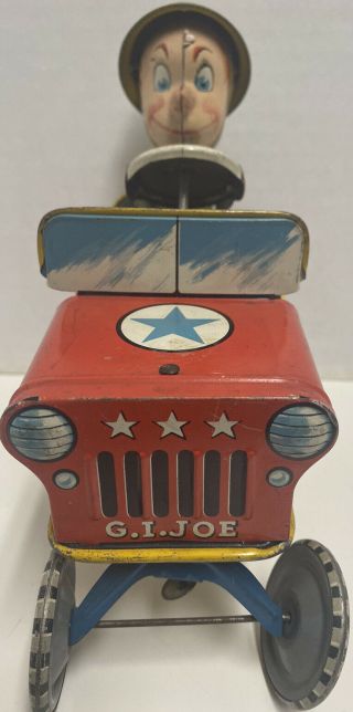 1940’s Unique Art Tin Wind Up G.  I Joe Jouncing Jeep