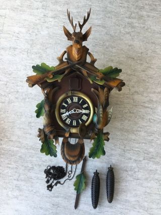 Vintage Regula German Wooden Cuckoo Clock With Deer Head And Rifle Motif Design