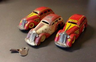 3 Louis Marx Pressed Steel Wind - Up Tricky Taxi 1930s