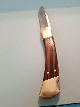 Buck 110 Folding Knife With Wood Handles Brass Bolsters Leather Sheathusa