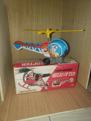 Vintage Tin Toy Wind Up Clown In Turn Around Hellicopter