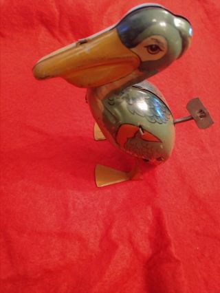 RARE TIN LITHO WIND UP TOY PELICAN WITH KEY WALKS CHEIN & CO.  USA 5in. 2