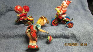 3 Vintage Tin Wind - Up Toys - Girl Bouncing A Ball And Two Santas.