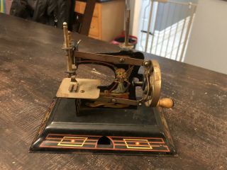 Antique 1920s Casige 121 German Made Childs Tin Toy Robin Hood Sewing Machine