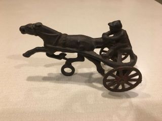 Vintage Cast Iron Sulky Horse & Jockey Toy With Movable Wheels.