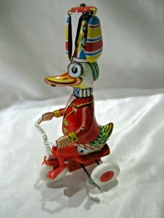 Vintage Litho Tin Duck On Bike With Twirling Hat Wind Up Made In West Germany