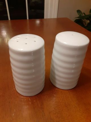 Crate And Barrel White Roulette Salt And Pepper Shakers