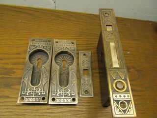 Single Eastlake Pocket Door Lockset.  With Escutcheons And Strike Plate Ornate