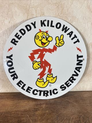 Vintage  Reddy Kilowatt  Gas Porcelain Sign 12  Round,  Great Subject Matter