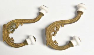 VINTAGE BRASS VICTORIAN STYLE HAT OR COAT HOOKS WITH PORCELAIN TIPS 2