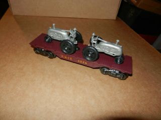 Marx 4528 Erie Flat Car With 2 Gray Tractors,  1950 