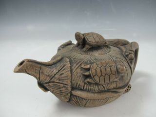 A Chinese Clay Carved Lotus Shape Teapot With Turtles