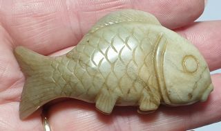 A Lovely Qing Dynasty Celadon Green Jade Carving Depicting A Swimming Fish