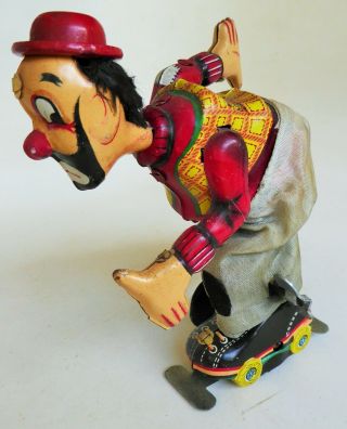 T.  P.  S.  Clown On Roller Skates Tin Litho Mechanical 1950 