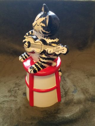 B.  Kliban Cat with guitar on stool Cookie/Dry material jar Tastesetter by Sigma 2