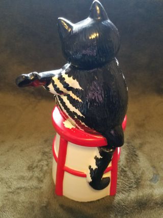 B.  Kliban Cat with guitar on stool Cookie/Dry material jar Tastesetter by Sigma 3