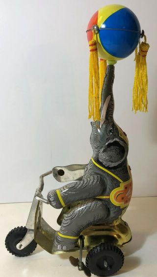 Vintage Tin Litho Toy Elephant On A Tricycle With Spinning Ball Wind Up