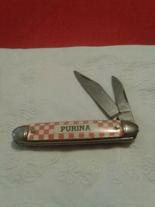 Purina Pocket Knife Red On One Side Checkered On Other