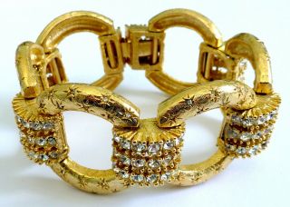 A Vintage 1950s Gold Tone Sphinx Designer Bracelet With White Diamantes