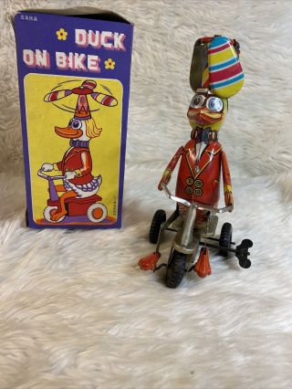 Vintage Duck On A Bike Wind Up Tin Toy W/ Spinning Fan Hat D4
