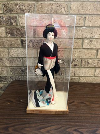 Japanese Geisha Doll 16.  25” On Wooden Stand With Plexiglass Cover