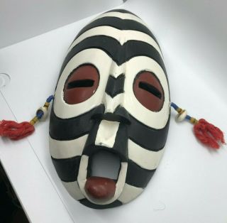African Mask Wooden Carved And Painted Black,  White Red Tassels Made In Ghana