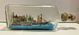 Vintage Handmade Ship In A Bottle With Village,  Ocean & Lighthouse Scene Unique